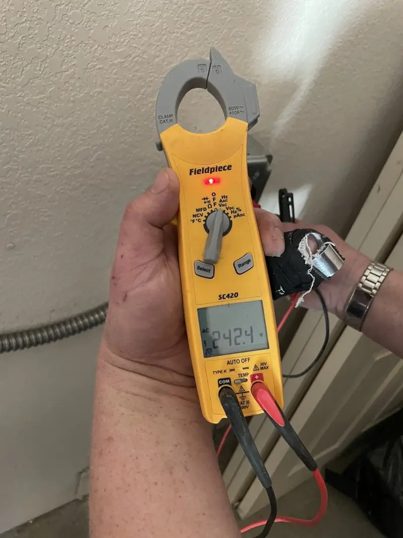 Voltage testing with clamp meter during Ceiling Fan Installation in Jasmine Estates